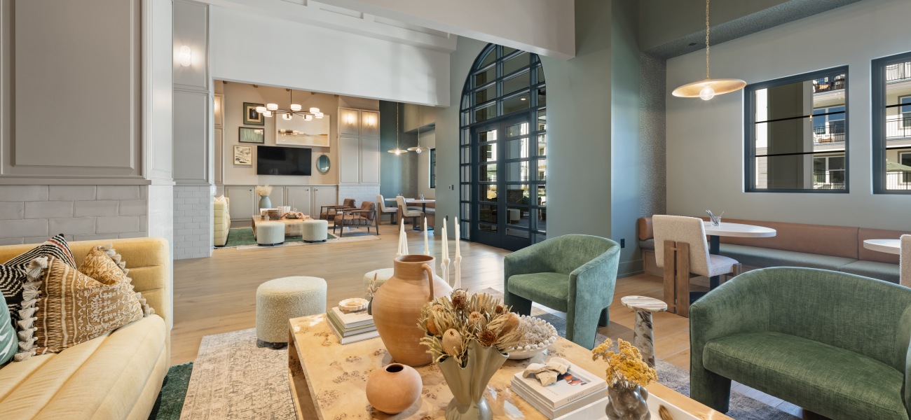 Resident lounge with chairs and sofa at Elan Capital Hills new apartments in Raleigh, NC. Resident lounge with chairs and sofa at Elan Capital Hills new apartments in Raleigh, NC.