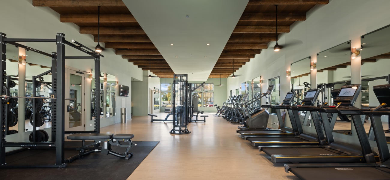 Raleigh apartment gym with treadmills and weight machines at Elan Capital Hills. Raleigh apartment gym with treadmills and weight machines at Elan Capital Hills.